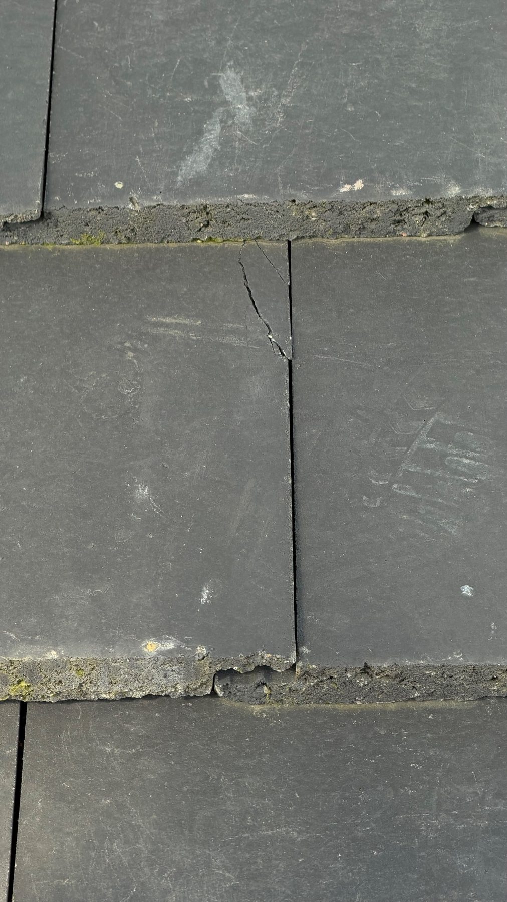 Cracked roof tile identified during inspection